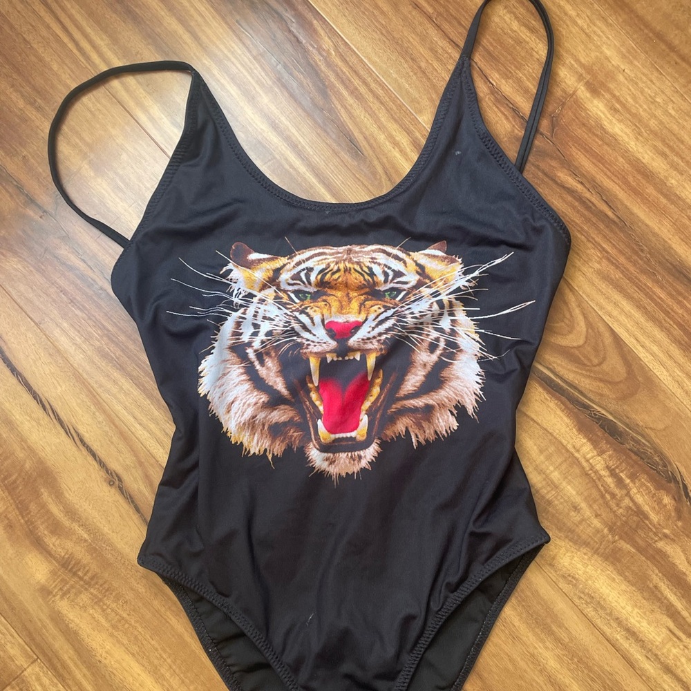 One piece black swimsuit.